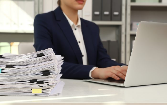Female worker with paperwork - Why Professionals Are Adopting Digital Platforms for Property Transactions