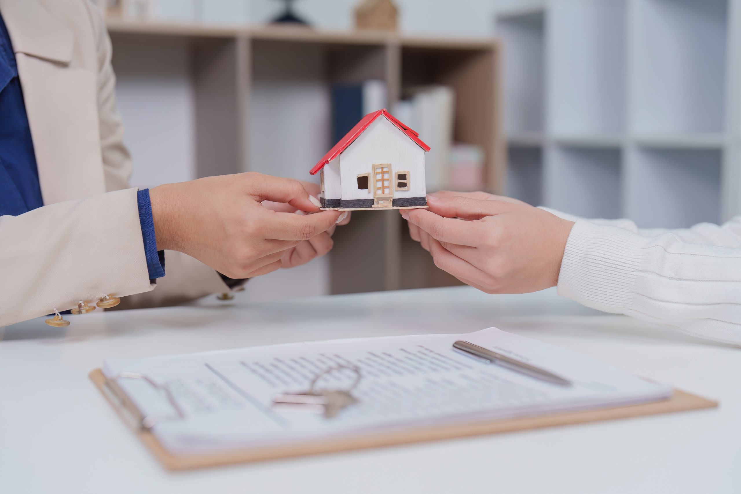 Property Handover with Miniature House Model and Signed Agreement Simple Ways to Improve the Property Transaction Process